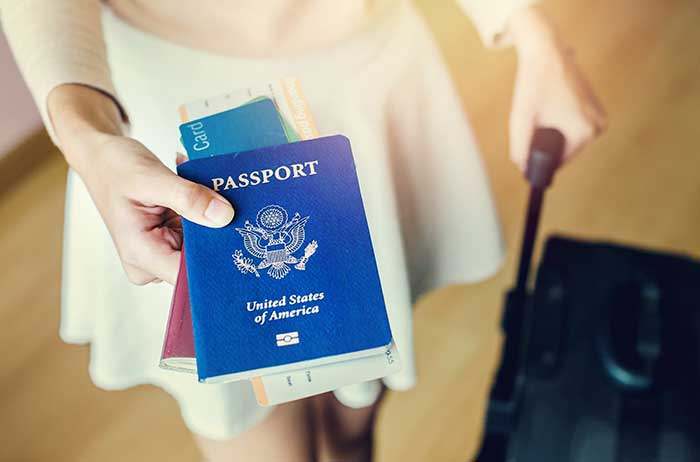 woman holding passport
